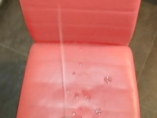 Cumming on a red chair