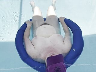 BBW floating naked in the pool