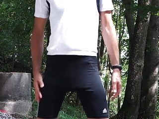 Crossdresser in tight spandex shorts