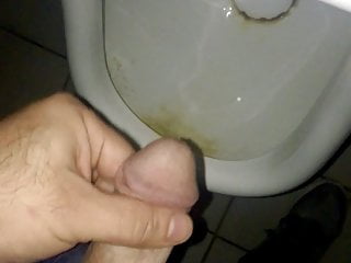 Brock pee in a public urinal.