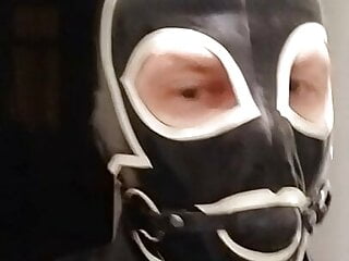 Latex mask gag slave