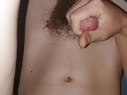 Teen masturbates and cums on his belly and navel