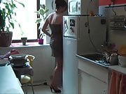 Alexia shows her kitchen in her black boots