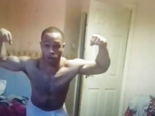 Black muscle flexing wearing a towel 