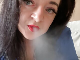Hot Mistress Lara sexually smokes in camera and shows her big boobs