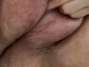 Playing with my hairy, saline filled pussy lips 