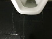 Pissing over the toilet at work