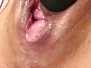MILF stuffs pussy with a cucumber and squirts like a slut