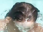 Girl exposes her big tits in the pool