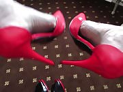 red heels in a baroque hotel room