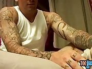 Inked stud Evan Heinze caresses feet and cock solo