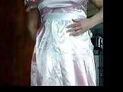 Playing in pink maids dress and frilly knickers