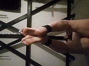 Smacking my slaves feet with a riding crop!