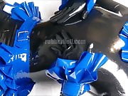 Shiny black catsuit and blue frills