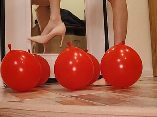 Heels crush balloons. Crushing heels