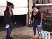 Cleavage girls bashing beer cans on their heads