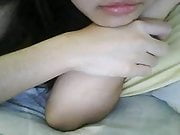 Chinese girl plays with tits