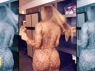 Cardi b plays in golden fishnets...