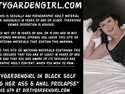 Dirty garden girl in black is fisting her own ass, anal prolapse